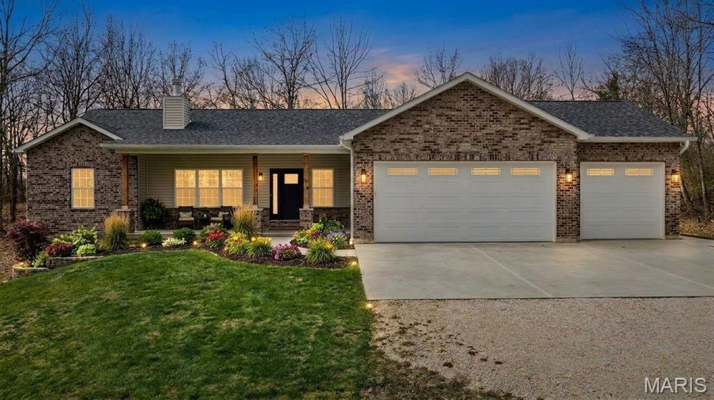 Built to be a forever home, an unexpected job relocation has created a unique opportunity for the next owner. Enjoy peaceful country living in this beautiful nearly new ranch home set on three private acres “NOT” in a subdivision. Thoughtfully designed and built with a custom kitchen at its heart, the open-concept main living areas are filled with natural light, creating a bright and welcoming atmosphere. This move-in-ready property offers the rare opportunity to enjoy the benefits of new construction without the wait. Ranch home sitting on 3 acres & "NOT" in a subdivision, public water, gateway fiber internet & only minutes from Hwy 70 & 79. Exterior offers partial brick front, covered front porch, vinyl siding to grade, enclosed soffits & fascia, 20 x 14 covered patio with ceiling fan & can lights, partial fenced yard, coach lights & a 3 car oversize garage with wet sink, service door & 8 ft garage doors plus less than a 10th of a mile off the black top road. Interior offers 3 bedrooms & 3 full baths plus one half bath, vaulted & 9 ft ceilings, wood burning fireplace, 2 inch blinds in bedrooms, ceiling fans, luxury vinyl plank flooring, carpet in bedrooms, can lights, main floor laundry room with cabinets & soft close doors & drawers, white trim & panel doors plus 5 1/4 baseboards. Kitchen offers custom wood cabinets with soft close doors & drawers, center island, stainless appliances, tile backsplash, walk-in pantry & granite counter tops. Master suite with walk-in closet & master bath with double sinks & walk-in shower* Side walkout basement with full bath completed by the builder, Aquasana whole home water treatment system, Aquasana whole home water softener, Lennox furnace & 50 gallon Bradford White hot water heater. This one is a pleasure to show