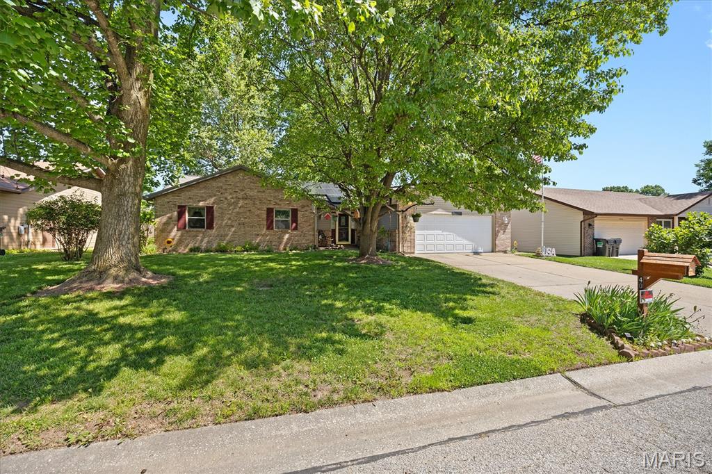 Well-maintained ranch home featuring vaulted ceilings, a cozy fireplace, a separate dining room, and a bright sunroom overlooking the fenced backyard. The spacious primary suite offers a private retreat, while the attached 2-car garage provides added convenience. Outside, enjoy the storage shed with electricity, perfect for a workshop, hobbies, or extra storage. Solar panels add energy efficiency. Conveniently located near shopping, restaurants, major highways, and Scott AFB. Seller is offering the home AS-IS.