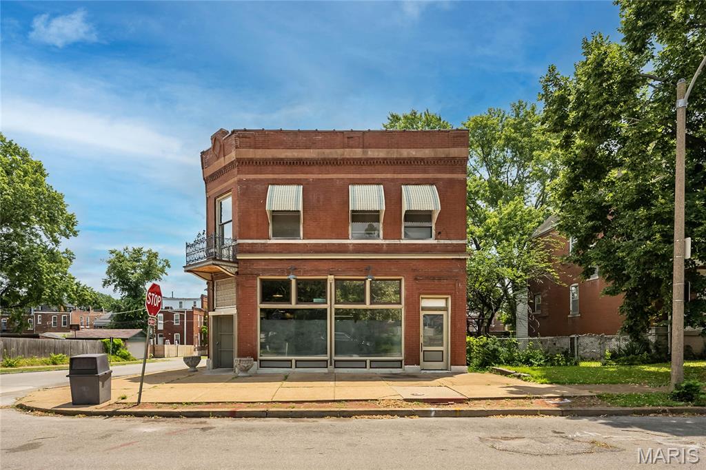 Exceptional opportunity in one of St. Louis' most vibrant historic neighborhoods. This iconic 1896 corner building offers approximately 3,960 square feet of space, presenting endless possibilities for investors, developers, entrepreneurs, or owner-users. The property features classic historic architecture with generous interior square footage, high ceilings, and a highly visible corner location ideal for commercial, mixed-use, creative office, retail, hospitality, or residential conversion (subject to zoning and approvals). Whether you're looking to restore a historic landmark, create loft-style residences, establish a destination business, or develop a unique live/work concept, this property provides the scale and character to bring your vision to life. Situated near thriving dining, arts, and entertainment district, with convenient access to downtown St. Louis, major highways, and surrounding neighborhoods, the location offers strong long-term investment potential. Bring your vision and unlock the possibilities this historic property has to offer. Property is being sold as-is. Buyers are encouraged to verify zoning, permitted uses, square footage, and redevelopment opportunities. Owner had a thriving grocery business for over 50 years in the first floor.  The 2nd floor apartment has been vacant for 30+ years and was used for storage. Selling as-is building needs renovation, lots of potential.  Offers encouraged!!
