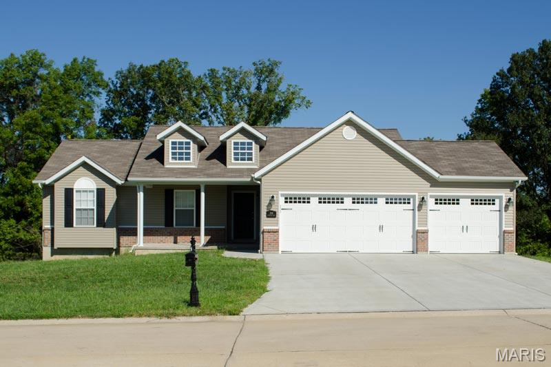 1,323 sq ft of comfortable living space with 3 bedrooms and 2 bathrooms. The home features a 2-car garage and a walk-out basement, offering great potential for additional living space or storage. The living room includes a vaulted ceiling, creating an open and spacious feel. The kitchen comes equipped with stainless steel appliances, and the home features durable luxury vinyl flooring throughout for a modern, low-maintenance finish. Expected completion date early fall.