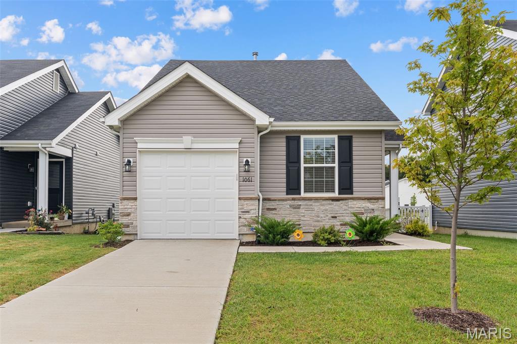 Welcome home to St. Andrews Meadows, where comfort, convenience, and easy living come together in this charming 2024-built cottage. Perfectly positioned directly across from Veterans Memorial Park and just minutes from local shopping and East Central College, this home offers an ideal setting for buyers looking for a move-in ready home in a peaceful, accessible location. Inside, you’ll find 2 bedrooms and 1 bathroom with a smart, inviting layout designed for everyday comfort. The living room, dining area, and kitchen flow together beautifully, creating an open and welcoming space that is perfect for relaxing, hosting, or simply enjoying life at home. The primary bedroom features a walkthrough double closet with convenient access to the bathroom.  Main-floor laundry, laminate flooring, vaulted ceilings, the kitchen cabinet package, Silestone counter tops & exterior stone accents are just some of the upgrades. Washer, dryer, stove, dishwasher & microwave are all included. The unfinished basement offers exciting potential for future living space, already equipped with a roughed-in bathroom, egress window, and sump pump—giving you the opportunity to expand when the time is right. Outside, enjoy afternoons in the backyard or take an evening stroll across the street to Veterans Memorial Park. Whether you’re buying your first home, downsizing, or looking for low-maintenance living in a great location, this inviting home is ready to welcome you. Schedule your private showing today and see why this could be the perfect place to call home.