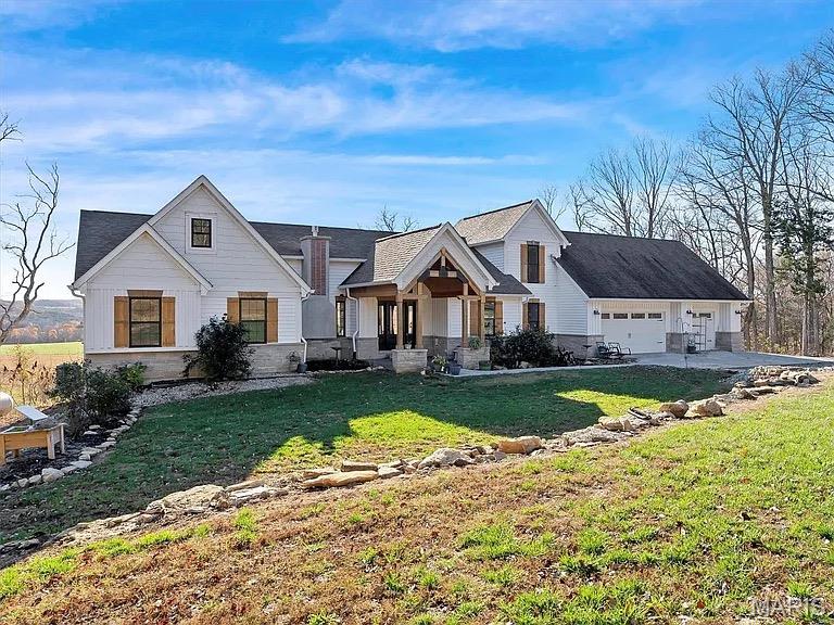 ARE YOU LOOKING FOR VIEWS, PRIVACY, COUNTRY LIVING CLOSE TO TOWN- This stunning 4 bedroom 4 bath home is nestled on an expansive 8.3 acres offering breathtaking views of the surrounding landscape and plenty of privacy. The exterior showcases charming natural wood shutters and elegant stone details that highlight the character of this beautiful property. Step inside to discover a spacious and inviting interior featuring a large kitchen with premium stainless steel appliances, a generous island and custom cabinetry that adds a touch of sophistication, while the expansive windows flood the space with natural light showcasing stunning views throughout. This home also boasts a full unfinished walk-out basement, providing endless opportunities for customization and additional living space. Prime location near wineries and surrounded by beautiful hiking trails! Don't miss the chance to make this exquisite property your own!