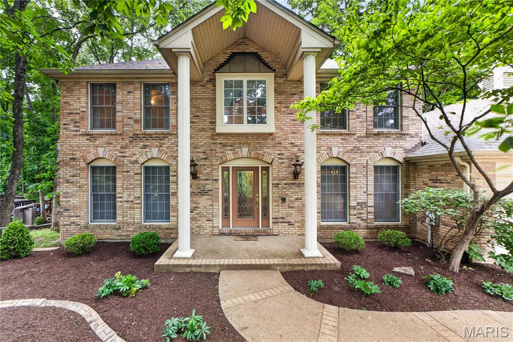 Welcome home! Nestled in a sought-after neighborhood and tucked into a beautiful, wooded lot.  Spacious 4 bedrooms and 2.5 bath 2 story brick home. Updated kitchen with stainless appliances, porcelain counter tops, and porcelain floor. Main floor laundry, abundant cabinet space, and a large pantry. This flows into the spacious Family room with bay window, beautiful brick fireplace, and a wet bar. There is a formal dining room and living room for more formal entertaining. The master suite is spacious and has a walk-in closet and a second closet The master bath has been updated and is fabulous! There are three additional bedrooms and a second full bath finishing out the upper level. Other features include a three-car garage, main floor laundry, newer roof, two furnaces and Neighborhood pool and tennis.