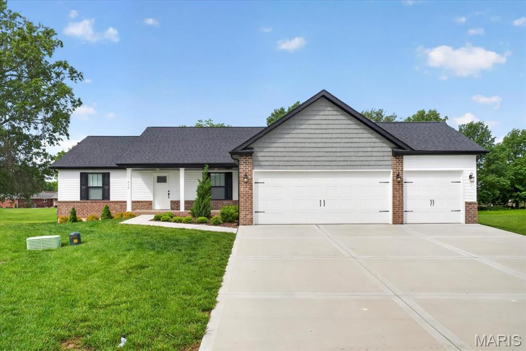 Welcome to this beautifully built 2024 ranch home offering modern finishes, an open layout, and room to grow! Situated on a large lot, this 3-bedroom, 2-bath home combines stylish design with everyday comfort. Step inside to soaring vaulted ceilings, luxury vinyl plank flooring, and a bright, open-concept living space perfect for entertaining. The spacious kitchen features custom wood cabinetry, stainless steel appliances, a large center island, and flows seamlessly into the dining and living areas. The private primary suite offers dual vanities, a walk-in shower, and an impressive custom walk-in closet system. Enjoy peaceful mornings or relaxing evenings on the covered back deck overlooking the expansive backyard. The unfinished basement is already plumbed for an additional bathroom and includes an egress window, giving you endless possibilities for future bedrooms, a family room, home gym, or additional entertaining space. Complete with a 3-car garage and thoughtful finishes throughout, this move-in ready home offers the perfect blend of modern style and future potential!