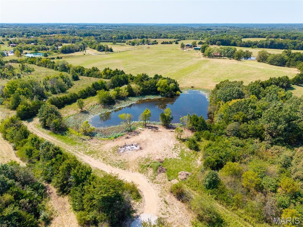 Build the life you've been dreaming about on 6.58 acres of private, peaceful land in New Bloomfield, Missouri. Lots 1 & 6 in Roark Acres offer a rare opportunity to create your own private retreat with a private lake, generous acreage, and the freedom to build without the limitations of an HOA. 

With no HOA and no covenants or restrictions, you have the flexibility to design and build a property that truly fits your vision and lifestyle. Whether you're dreaming of a custom home surrounded by nature, a peaceful place to escape, or simply room to spread out and enjoy the outdoors, this property offers endless possibilities. 

Come create something that is uniquely yours at Lots 1 & 6 Roark Acres - where the possibilities are as wide open as the land itself.