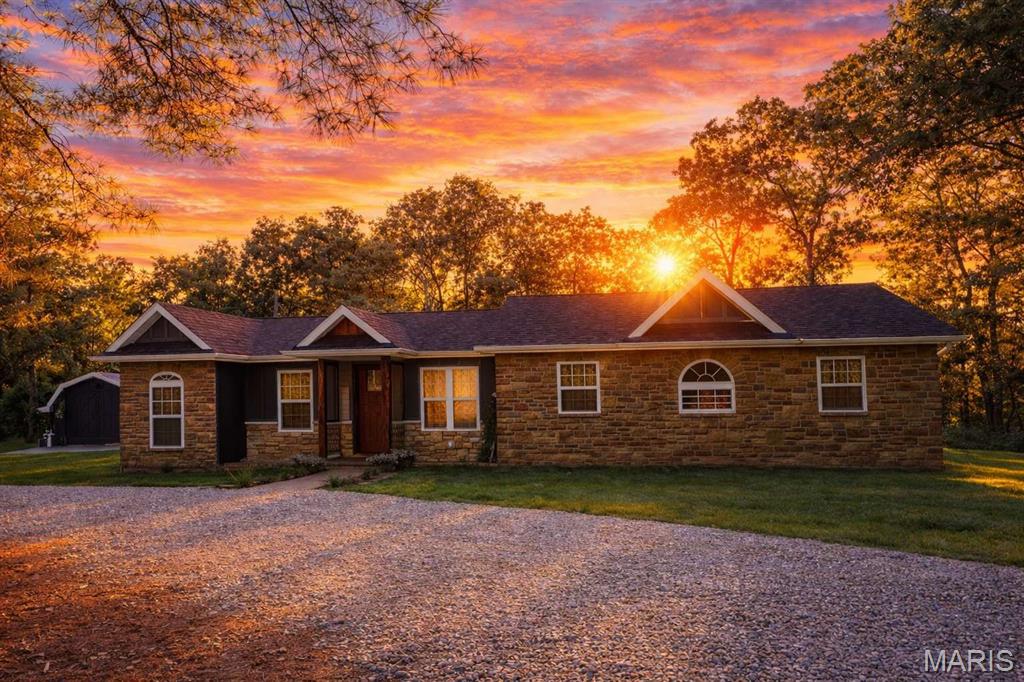 Contingent upon the sale of the buyer’s home with a kick-out clause in place. Seller is actively accepting showings and welcomes backup offers. Don’t miss your opportunity to view this beautiful 10.8-acre property—now offered at a new price! NEW PRICE Motivated to work with serious buyers seeking the perfect retreat. Homes with this privacy and custom quality don't come along often. Schedule your private showing today. Stunning ranch-style home situated on 10.8 acres, featuring extensive custom craftsmanship throughout. Originally built in the 1980s, this home has been thoughtfully remodeled and expanded with high-quality finishes and attention to detail. Interior highlights include solid hardwood floors, tile flooring, custom cabinetry, and beautifully finished wood ceilings. Bathrooms feature durable and stylish Onyx shower walls. The exterior showcases stone accents, LP SmartSide siding, and stamped concrete patios and walkways, creating both beauty and functionality. The property also features established peach, cherry, and apple trees, along with raised strawberry garden beds, offering a perfect blend of beauty, sustainability, and outdoor enjoyment. Designed for comfortable main-level living with an open, flowing layout, this property offers the ideal mix of modern updates, timeless craftsmanship, and peaceful country living. Originally built in the 1980s, this home has been thoughtfully remodeled and expanded with high-quality finishes and attention to detail. Bathrooms feature durable and stylish Onyx shower walls.