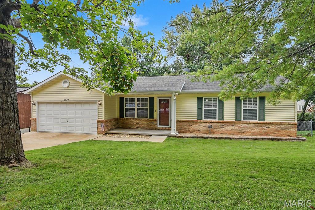 Welcome home to this beautifully maintained 4-bedroom, 3-bath ranch offering an open floor plan and spacious living areas. The stunning great room features soaring vaulted ceilings, creating a bright and inviting space for everyday living and entertaining and offers easy access through sliding glass doors to a large deck overlooking a private, tree-lined backyard. The eat-in kitchen is equipped with stainless steel appliances. The main floor also includes a large laundry room, a spacious primary suite, and two additional bedrooms with brand-new carpet and another full bathroom. The finished walk-out lower level provides exceptional additional living space with a large recreation room, fourth bedroom, full bath, abundant storage, and access to a large patio beneath the deck—perfect for relaxing or entertaining outdoors. Additional updates include a new A/C condensing unit (2021), new furnace (2018), new water heater (2024), and new basement flooring (2019). Complete with a 2-car garage and a peaceful backyard setting, this move-in-ready home offers the perfect combination of comfort, functionality, and privacy.