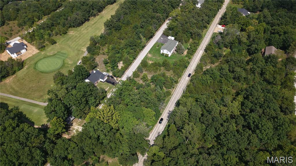 Nicely Cleared Leveled Lot — Right across from the Golf Course! Near The Big Lake, Big Houses, & Beautiful New Construction! Check out this prime buildable lot right on the golf course with water, sewer, and electric on site! This lot can be combined with the lot next door making it a great double lot to build one custom dream home or two homes on. Buy as an individual lot for lake access or check out the neighboring golf course lots to purchase as a package and save, save, save! These ready-to-build home sites and buildable lots are located in this private, gated, resort-style community with breathtaking views four lakes, a white, sandy beach area, golf course, campgrounds, swimming pool, fitness center, and more. Perfect for builders planning to build several homes at once or to anyone seeking a peaceful, recreational lifestyle away from St. Louis, but still very close for easy family visits. Also perfect for get-away lake home. Enjoy the golf course, lake, boating, fishing, clubhouse, pool, etc. ! Just 20 minutes from The Heart of Saint Louis!  
Builders Package: