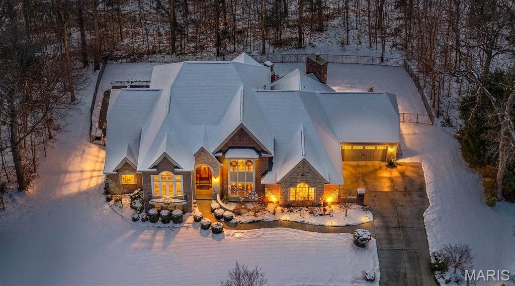 This residence is an elite, custom-crafted masterpiece—in prestigious Meridien. Poised on a 2.37-acre lot, this 10-year-new 1.5-story exudes grandeur through intricate, rich millwork, soaring architectural ceilings & floor-to-ceiling windows that wrap the interiors in natural light—features rare & irreplaceable in today’s era of conventional, quick builds. 

Expert, robust construction by Greg Sommerhof partnered with Nick Godat’s timeless architecture design deliver an exquisite and sophisticated living experience. The great room is a gallery of breathtaking views, framing the private, peaceful pool and backyard while the gourmet kitchen showcases a grand island, high-end stainless appliances & seamless, open flow to the elegant great room, hearth room, breakfast nook & screened porch.

The main-floor primary suite is a private sanctuary, featuring a comforting fire place, sculpted cove ceiling & spa-inspired bath. A striking study, with soaring ceilings, French doors & Juliet balcony, spans primary & upper levels. Upstairs are 3 large bedrooms—plus a bonus room. 

The finished walkout lower level offers a vast rec room, 5th bedroom, wet bar, full bath & dramatic indoor gym crowned by lofty ceilings & an indoor basketball hoop—all opening directly to the lush pool terrace, outdoor fireplace & patio.

The oversized 4.5-car garage fits 5 vehicles, catering to car enthusiasts. All this in Award-winning Rockwood Schools. Truly a rare and exceptional opportunity!
