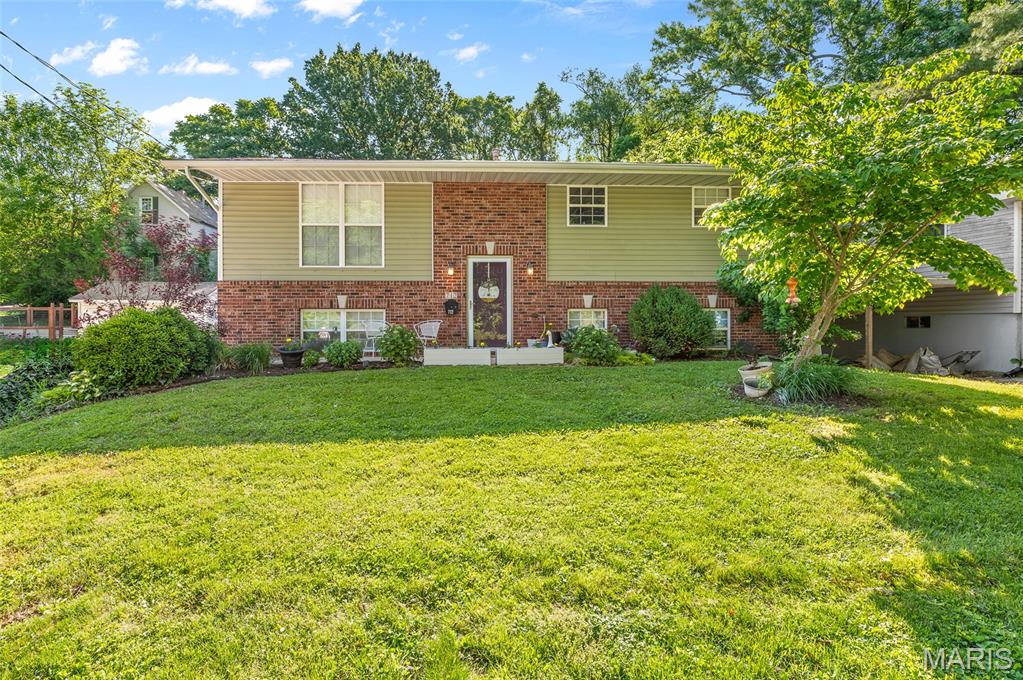 Beautifully maintained 3-bedroom, 3 full-bath home situated on a spacious double corner lot! This inviting property offers the perfect blend of comfort, functionality, and outdoor living. The private primary suite features a large walk-in closet, spacious en suite bathroom, and convenient in-suite laundry. The updated kitchen includes modern appliances and flows seamlessly into the main living space. The finished lower level offers incredible additional living space with 2 bedrooms, a full bathroom, and a cozy family room complete with a bar — perfect for entertaining guests or relaxing evenings at home. Step outside to enjoy the beautiful saltwater above-ground pool and the expansive 17.5 x 13 covered deck, ideal for outdoor dining and summer gatherings. Garden enthusiasts will love the raised garden beds and versatile shed that could easily serve as a workshop, potting shed, or extra storage space. With generous indoor and outdoor living areas, this property is truly a must-see! Will pass City of Collinville Occupincy before closing. Home is being sold AS IS, no repairs to be made.