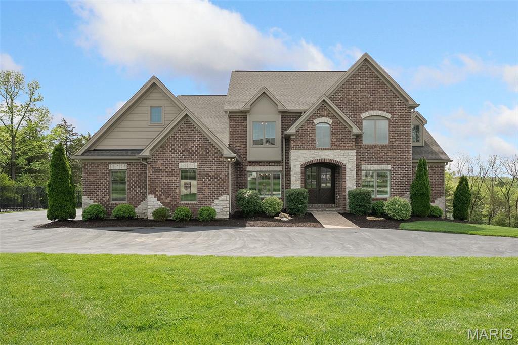 Huge Price Adjustment! Welcome to The Stonemont Court Estate. Set on 1.68 acres in a quiet Town & Country enclave, this 1.5-story Rehnquist-built home offers thoughtful design and high-end amenities. Built in 2019 and enhanced in 2023, it features a saltwater pool with heated system, ambient lighting, and waterfall. Inside, 11’ ceilings and oversized windows brighten open living spaces anchored by a designer kitchen with 10’ island. The main-floor primary suite includes heated floors, dual closets, soaking tub, and frameless shower. The finished walkout lower level includes a full-window gym, lounge, full bath with pool access, and a private office that can function as a 5th bedroom. Additional highlights: 10’ pour, 4-zone HVAC, RainTight patio cover, and oversized 3-car garage.  Luxury, flexibility, and space—now at a compelling new price.