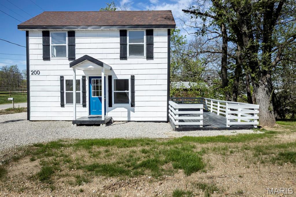 This beautifully renovated 3 bedroom, 2 bathroom two-story home sits on a corner lot and offers a fresh, modern feel throughout. Step inside to find neutral paint tones and vinyl plank flooring that create a clean, inviting atmosphere. The kitchen is bright and functional, featuring butcher block countertops, ample workspace, and a convenient breakfast bar, perfect for both everyday living and entertaining. The basement offers the 3rd bedroom that could easily serve as a family room, bonus space, or flex area to fit your needs. With an open layout and updated finishes, this home blends style and comfort seamlessly. Outside, enjoy a great deck space ideal for relaxing, grilling, or hosting gatherings.