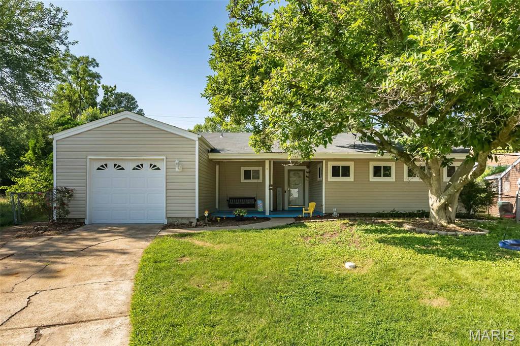 Get ready to fall for this one! Tucked away on a quiet cul-de-sac, this adorable 4-bedroom ranch packs a whole lot of living into 1,342 square feet with an open floor plan, smart layout, and easy one-level living! Grab your morning coffee and unwind on the oversized covered front porch before stepping inside to updated flooring throughout and bright, inviting spaces that instantly feel like home.

The spacious living room flows effortlessly into the dining area, making game nights, birthday parties, and holiday dinners a breeze. The kitchen checks all the boxes with stainless steel appliances, loads of cabinet space, custom backsplash, and a window overlooking the backyard so you can keep an eye on the kids, the dogs...or both!

The primary suite features a beautifully updated bath with a gorgeous custom walk-in tile shower you'll love coming home to. Three additional bedrooms, an updated hall bath, and convenient main-floor laundry make everyday living simple.

Now let's talk about the backyard...because it's BIG! Fully fenced with plenty of room for soccer games, swing sets, gardens, cookouts, or simply letting the kids and pups burn off some energy. The patio is ready for summer evenings with friends and family.

Even better? The big-ticket items are already done for you! New roof in 2026, plus furnace, A/C, and gutters replaced in 2021. The oversized 20x14 garage gives you extra room for bikes, tools, and all the weekend toys.

Located just minutes from shopping, dining, parks, and iconic Ted Drewes, this home offers the perfect blend of convenience, comfort, and charm. Skip the stairs, enjoy the space, and start making memories from day one. Homes with four bedrooms, this much yard, and updates like these don't come along every day!

OPEN HOUSE SUNDAY JULY 26 FROM 11-1PM