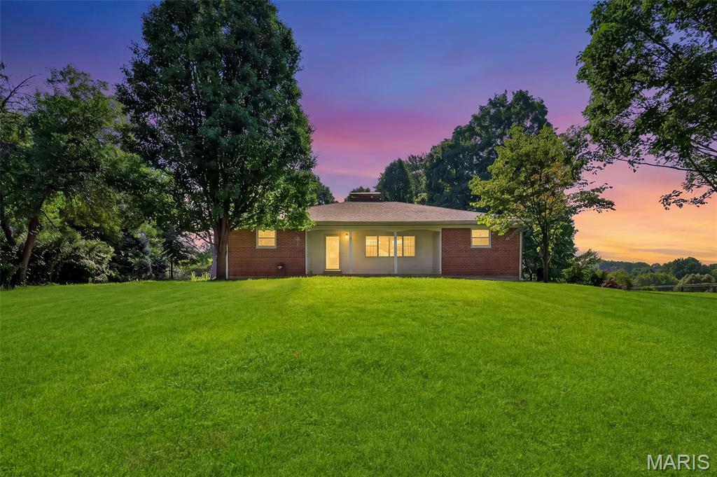 (OPEN SUNDAY 1pm-3pm!) Welcome home to your own private retreat in the heart of Bridgeton! This 3-bedroom, 1.5-bath home has already passed the Bridgeton occupancy inspection, making for a smoother closing and move-in process. Situated on a private 0.66+/- acre lot, the home sits back off Taylor with a long, extended driveway, mature trees behind the property, and a spacious front yard that provides both privacy and plenty of outdoor space. The exterior you'll love! Features include the low-maintenance composite deck, perfect for relaxing or entertaining, along with the detached 3-car garage featuring a 2-car overhead door in the front and an additional single-car overhead door in the rear; Ideal for extra parking, storage, or a workshop. The glass enclosed sunroom is filled with natural light and offers a great spot to enjoy your morning coffee or unwind at the end of the day. Inside, the kitchen features updated flooring, brand new stainless steel appliances, and opens to the dining area for easy everyday living. The living room offers a cozy wood-burning fireplace and plenty of space to gather with family and friends. The primary bedroom includes a walk-in closet and washer and dryer hookups, while a second laundry area is located in the basement. The lower level is ready for your finishing touches and already includes two carpeted bonus rooms that work well as an office, hobby room, playroom, or additional flex space. The basement also offers custom shelving added in for extra convenience. In-addition, the HVAC system was just replaced a year ago! If you've been looking for a home that offers privacy, a large lot, great garage space, and room to make it your own, this Bridgeton property is one you won't want to miss.