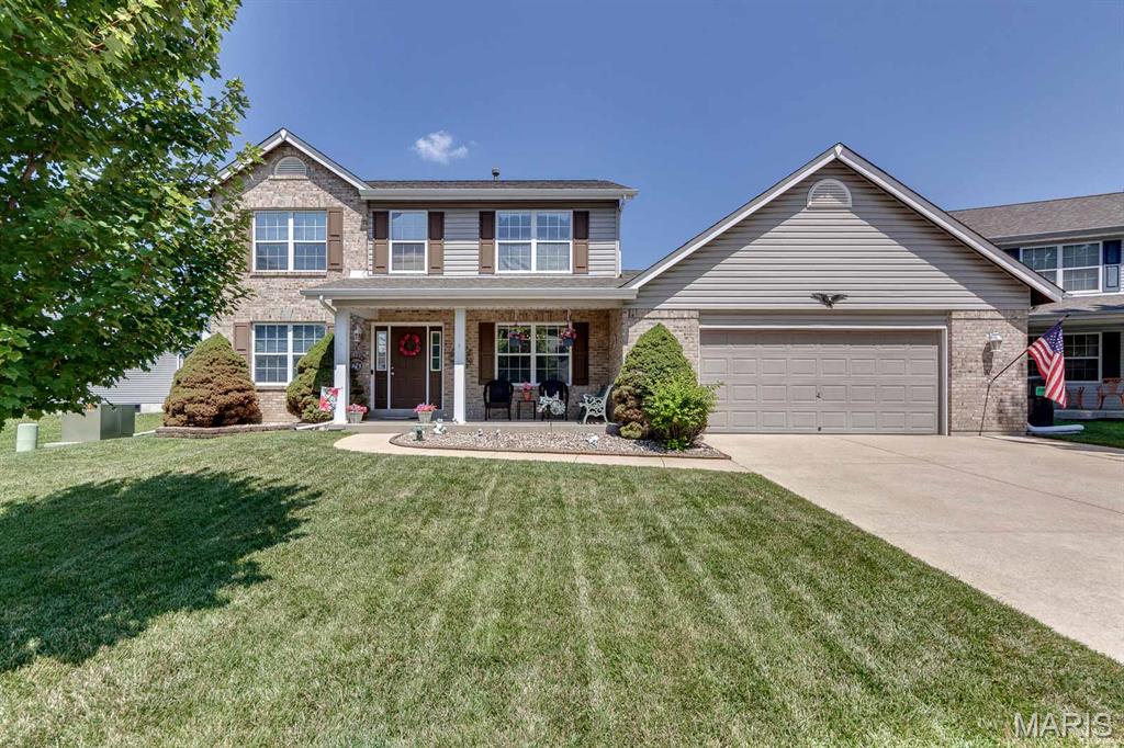 Welcome to this spacious 4-bedroom, 4-bathroom home offering approximately 3,000 square feet of living space, tucked away on a quiet cul-de-sac in St. Charles. The main level features an open floor plan with a large living room highlighted by a wood burning fireplace and oversized bay windows that fill the space with natural light. The eat-in kitchen includes a breakfast bar, ample cabinet space, and direct access to the patio, making it ideal for everyday living and entertaining. A convenient main floor laundry room completes the first level. Upstairs, the vaulted primary suite offers a spacious retreat with a private en-suite bathroom featuring a double vanity, separate soaking tub, and walk-in shower. Three additional bedrooms and another full bathroom provide plenty of space for family or guests. The finished lower level adds a large recreation area perfect for a playroom, media room, or entertaining, along with a full bathroom and additional storage. Outside, enjoy the oversized backyard with a patio and deck, providing plenty of room for outdoor gatherings, play, or relaxation. oversized garage and driveway for all your toys. Located near major highways, shopping, dining, and top-rated schools, this home combines space, functionality, and a desirable St. Charles location.