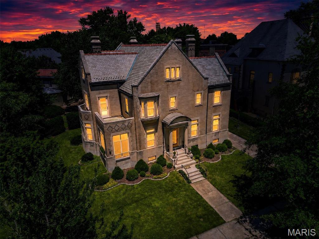 A once in a generation architectural treasure set upon one of the largest and most coveted estates in historic Compton Heights. Designed in 1905 by renowned architect Theodore C. Link, whose legendary works include St. Louis Union Station, the Mississippi State Capitol, and many of the city's most celebrated Gilded Age residences, this extraordinary home stands as a rare surviving example of St. Louis' golden era of craftsmanship and design. Commissioned for Edward T. Haase, son of August C.L. Haase, founder of The A.C.L. Haase Company, one of America's largest importers of specialty foods in the late nineteenth and early twentieth centuries, the residence reflects the prominence, sophistication, and enduring legacy of one of St. Louis' influential entrepreneurial families. Nestled within Compton Heights, one of America's earliest and most prestigious private residential enclaves, the home occupies an exceptionally large, park like parcel surrounded by lush, mature landscaping and magnificent grounds. The stately brick and stone facade presents an unforgettable arrival, showcasing the permanence and artistry synonymous with Link's most distinguished commissions. Inside, more than six bedrooms and three and one half baths unfold across beautifully proportioned living spaces adorned with pristine original millwork, intricate wood detailing, leaded glass, pocket doors, and architectural elements seldom found in such remarkable condition today. Every room tells a story, preserving the elegance and character of a bygone era while offering an extraordinary opportunity for modern stewardship. Adding to the home's rarity is the original drive through carriage garage complete with chauffeur's quarters above, a remarkable reminder of the property's grand beginnings and a feature seldom preserved in historic residences of this caliber. For over a century, this residence has remained a landmark of architectural significance, timeless beauty, and historic distinction. Remarkably, since its completion in 1905, this storied estate has remained quietly held and carefully stewarded, never before presented to the open market. More than 120 years later, this extraordinary offering marks the first opportunity for a new owner to acquire one of Compton Heights' most architecturally significant and historically important residences. More than a home, 3523 Longfellow Boulevard is a living piece of St. Louis history, an irreplaceable legacy estate where architectural pedigree, provenance, and enduring grandeur converge.