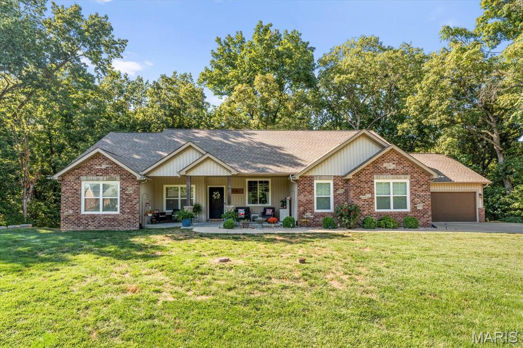 OPEN HOUSE: TUESDAY, JUNE 2ND FROM 4-6 PM. Stunning custom home with a private setting and incredible sunset views—this is the perfect home in the desirable Chantilly Village! This 5 bed / 4.5 bath ranch features an open concept with loads of windows, luxury vinyl throughout, a stunning built-in in the living room, and a gourmet kitchen with tons of beautiful cabinets, a large center island, and a walk-in pantry. Enjoy a phenomenal 3-seasons room with EZ Breeze system and a composite deck with stairs directly off the dining area, overlooking the secluded backyard. The split-bedroom floor plan offers a Jack & Jill setup on one end (each bedroom with its own sink and walk-in closet) and the luxury primary suite on the other, complete with a large walk-in tile shower, double vanity, professionally organized walk-in closet, and laundry room access. There’s also a great-sized office with barn doors for privacy. The lower level is designed with a living room, gaming/bar area, 2 bathrooms, and 2 bedrooms (one set up as a primary suite, both with walk-in closets), plus a huge storage room with another laundry hookup and walkout access to an additional patio.
Additional features include: two 200-amp electrical panels, geothermal heating with smart thermostat, smart garage door openers, smart switches, smart refrigerator, Culligan water softener, leaf guards on gutters, retaining wall and riprap rock, a custom-built drop zone, and a custom dog kennel in the laundry area.
Don’t let this unique home pass you by!
