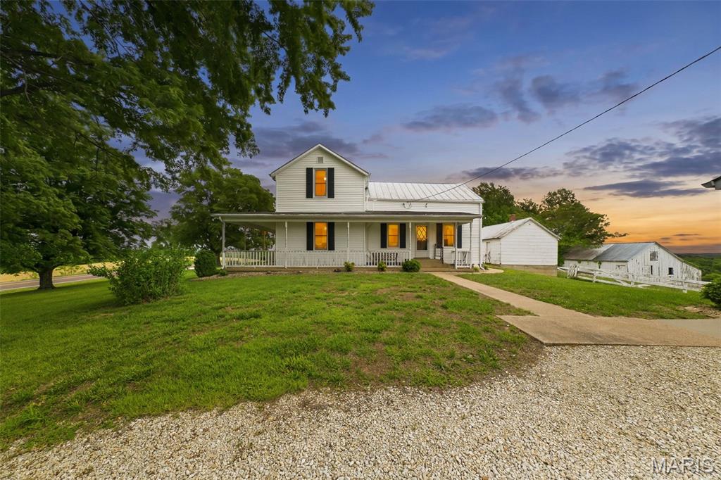Wow–what an amazing view! Check out this beautiful farmhouse built in 1880 located just outside of New Haven, MO. This home offers main floor living and has an updated kitchen, giving you a nice mix of old charm and modern convenience.The property includes a large detached 2-car garage along with extra outbuildings, perfect for storage, hobbies, or farm use.
Sitting on 38.9 +/- acres, there’s plenty of room to spread out. The land features a small pond, great topography, and stunning views throughout. This property would be great for a homestead, family compound, wedding/event venue, future development, or a great location to build your dream home. So much potential with this location. Located in the Washington School District, it’s just minutes from downtown New Haven, about 15 minutes to Washington, and around 20 minutes to Hermann. Don’t miss this great investment opportunity! Duplicate Listing MLS #26027995