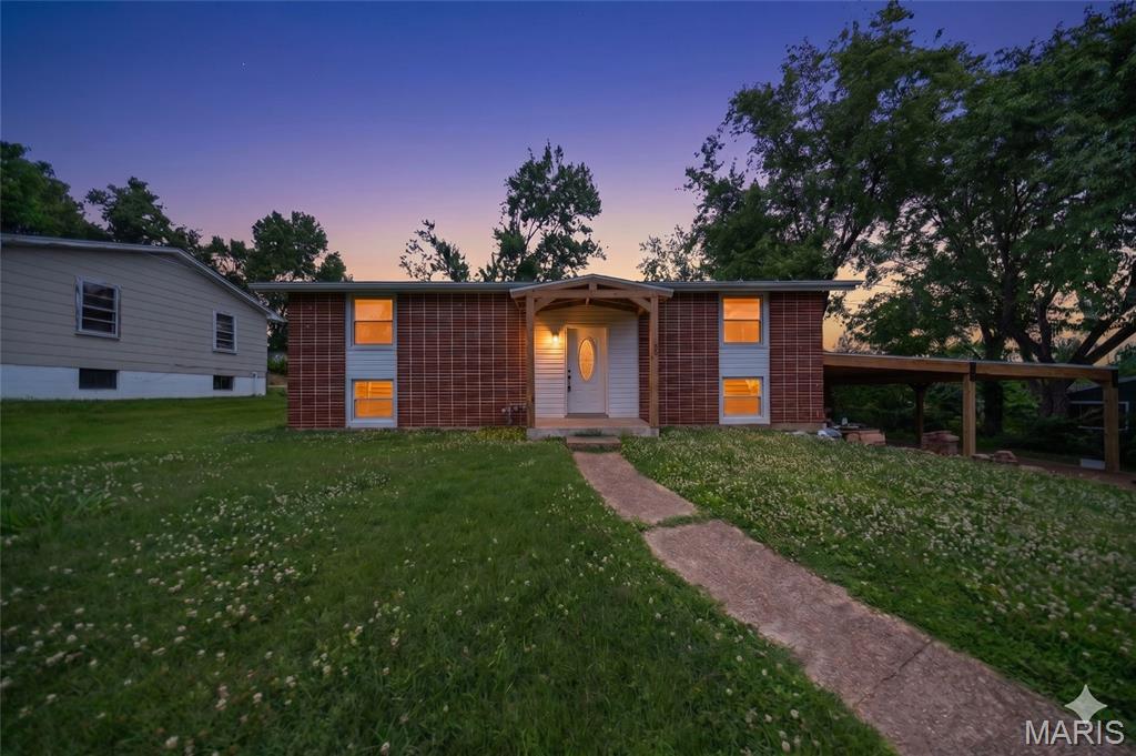 Welcome to this charming 3-bedroom, 1.5-bath split foyer home in the heart of Rolla! Featuring numerous recent updates, this move-in ready property offers a perfect blend of comfort and convenience. The spacious interior includes an inviting living area and a primary bedroom highlighted by a cozy electric fireplace, creating the perfect retreat at the end of the day. Recent improvements include a new roof, new siding, new appliances, and a large new carport, providing both style and peace of mind. Outside, you'll find an outdoor storage shed for all your tools and equipment, plus plenty of space to enjoy. Conveniently located near schools, shopping, dining, and everyday amenities, this home is a must-see.