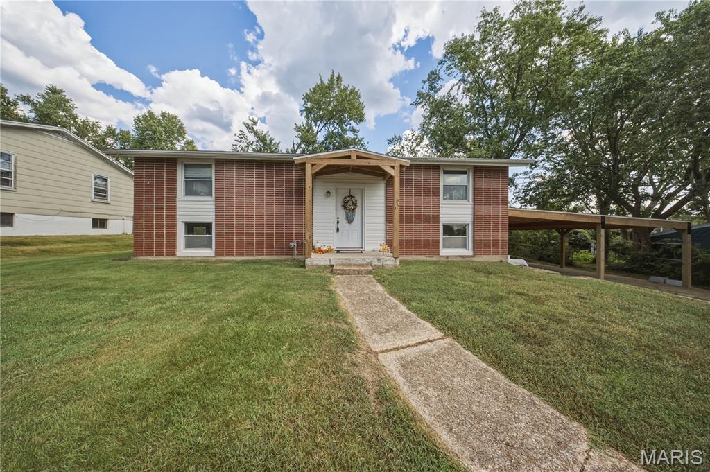 Welcome to this charming 3-bedroom, 1.5-bath split foyer home in the heart of Rolla! Featuring numerous recent updates, this move-in ready property offers a perfect blend of comfort and convenience. The spacious interior includes an inviting living area and a primary bedroom highlighted by a cozy electric fireplace, creating the perfect retreat at the end of the day. Recent improvements include a new roof, new siding, new appliances, and a large new carport, providing both style and peace of mind. Outside, you'll find an outdoor storage shed for all your tools and equipment, plus plenty of space to enjoy. Conveniently located near schools, shopping, dining, and everyday amenities, this home is a must-see.