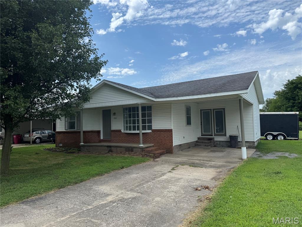 This three bedroom home is newly remodeled and move-in ready.  New flooring and paint on the interior.  Air conditioner is less than a year old.  Water heater is four years old.  Open kitchen and dining area, laundry closet, and pantry in the kitchen.  Bay window and vaulted ceiling with a ceiling fan in the living room.