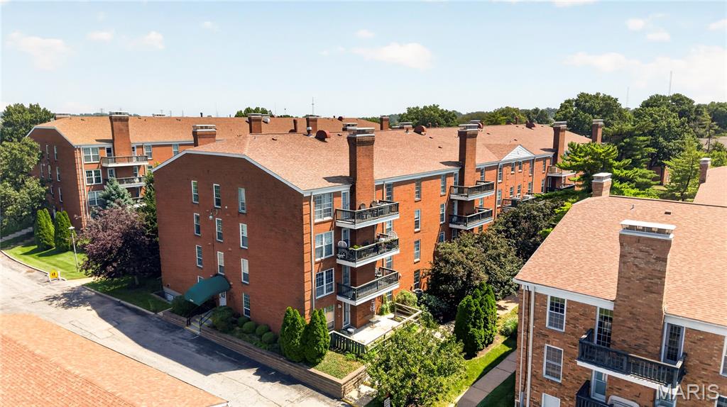 Spacious 2-bedroom, 2-bath + den condo offering 1,718 sq ft of comfortable one-level living in a convenient St. Louis location. This condo features a generous living room with a decorative fireplace, separate dining room, well-sized kitchen, versatile den, and a spacious primary bedroom. Enjoy additional outdoor living from the private balcony overlooking the landscaped grounds and community pool. The property also offers generous storage in the unit and 1-car space in the lower garage.  Conveniently located near public transportation and within the Pattonville School District, with easy access to shopping, dining, and everyday amenities. A great opportunity to make this spacious condo your own!