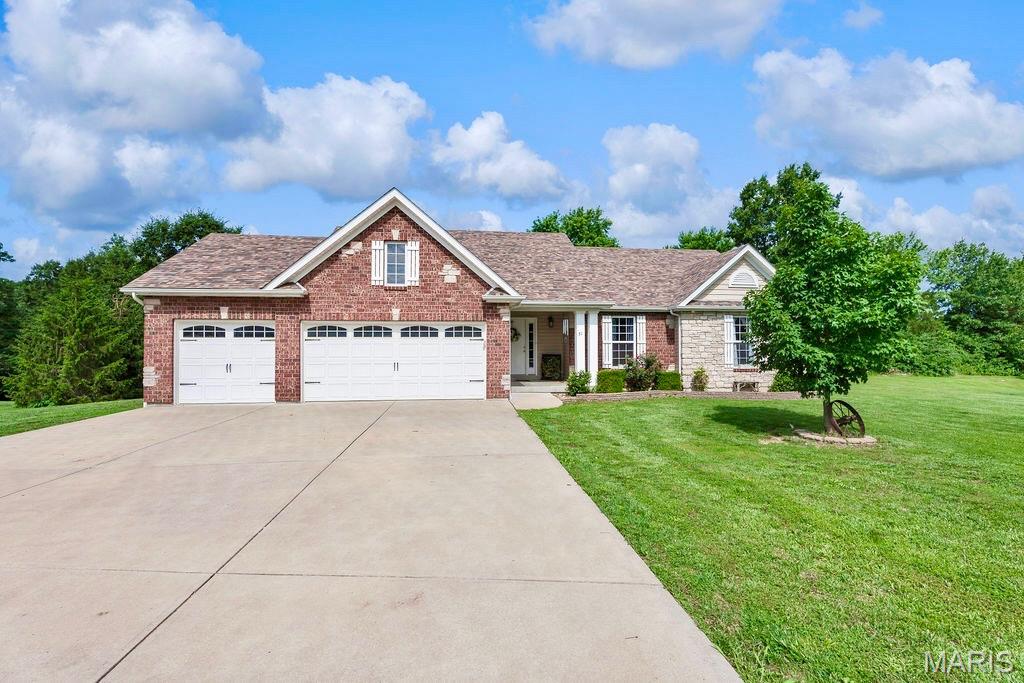 Welcome home to Pine Lake Estates, where peaceful country living meets stunning natural beauty.  Situated on approximately 2.4 acres in Southern Lincoln County, this beautifully maintained ranch offers picturesque water views, wooded privacy, and a park-like setting that's difficult to find.  The vaulted Great Room features rich flooring, a floor-to-ceiling stone fireplace, and an open-concept design that flows seamlessly into the spacious Kitchen complete with center island, abundant cabinetry, and large pantry.  The private Primary Suite provides a comfortable retreat, while the walkout lower level offers additional living space and future expansion potential.  Step outside to the cedar deck overlooking mature trees and tranquil surroundings, perfect for morning coffee or evening sunsets.  Enjoy the convenience of a 3-car garage, attractive soffit lighting, and a property that backs to woods while also offering beautiful pond views.  A rare opportunity to own acreage, privacy, and scenic beauty all in one exceptional package.  OPEN HOUSES ON BOTH SATURDAY, JUNE 27 12pm - 2pm AND SUNDAY, JUNE 28 12pm - 2pm.