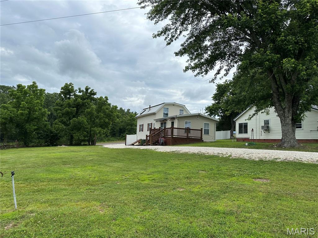 WEEKEND GET-AWAY!!! This beautifully remodeled farmhouse is bursting with character, charm, and modern updates while maintaining its warm, inviting appeal. Situated on 7.18 picturesque acres, this one-and-a-half-story home offers the perfect blend of comfort, privacy, and country living. Inside, you’ll find a spacious bedroom, two full bathrooms, and a versatile office that could easily serve as a non-conforming second bedroom. Custom millwork throughout the home adds timeless elegance and showcases the craftsmanship that makes this property truly special. Even the staircase is removable, making it easier to carry furniture upstairs. built in nooks for additional storage. Every detail has been thoughtfully updated, including a high-efficiency HVAC system for year-round comfort and energy savings. Start your mornings in the cozy sunroom with a cup of coffee while taking in the serene views, or unwind after a long day surrounded by nature. Outside, a pond enhances the property’s peaceful atmosphere and provides the perfect backdrop for enjoying country life. The 7.1-acre property offers plenty of room to roam, garden, enjoy wildlife, or simply soak in the tranquility of rural living. For hobbyists, entrepreneurs, or those needing extra storage, the impressive 40’ x 40’ workshop features electric service and a concrete floor, along with an attached lean-to offering additional covered parking and storage space. There is also an additional carport and a 1 1/2 story storage building for all your hobbies. With its extensive renovations, custom finishes, peaceful setting, and acreage, this one-of-a-kind farmhouse is the perfect place to escape the hustle and bustle while still enjoying modern comforts. Truly a must-see property!