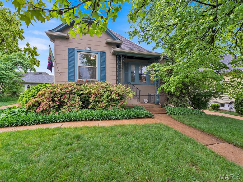 Open Sunday 5/17 1-3 Charm abounds in this sweet, 100-year-old cottage with all you need for a relaxed, 2026 lifestyle. High ceilings; multiple windows, accented with plantation shutters; and even skylights give the house a open, spacious atmosphere. Beautiful hardwood floors add to the warmth. The living room features a non-functional brick and tile fireplace with a built-in, electric, faux flame.  It is flanked by built-in bookcases and cabinetry. A lovely bay filled with tall windows pours light into the dining room. Handsome cabinetry keynotes the kitchen which includes a built-in planning desk and marble-topped center island with seating for two. Enjoy meals on the adjoining screened porch with views of the charming patio. In the hallway, just off the kitchen, a half bath allows for ease of entertaining. The well-appointed primary bedroom includes a large, skylighted bath that serves as a dressing room as well. It includes a large clothes closet, a linen closet and even a built-in ironing board.
The additional bedroom offers total flexibility. It can serve as a convenient home office but includes the possibility of converting to a second bedroom for family or guests with a built-in Murphy bed. A full basement and walkup attic provide abundant storage. The backyard includes a large, nicely landscaped patio and newer, oversized two car garage with options for additional, off-street parking. The convenient location is close to both the historic, downtown Old Webster and equally historic Old Orchard neighborhoods and their charming restaurants and shops. It is equally convenient to Webster Groves High School and Webster University. Both the roof and HVAC systems have been replaced within the last two years. Seller prefers to sell the home "as is" but has had the Webster Groves Occupancy Inspection and will complete all items cited to allow the buyer of obtain a occupancy permit. Showings begin May 8. Easy to show; need confirmed appointment. The seller is offering a one-year Choice Home Warranty Choice Plus plan covering major systems and appliances for buyer's peace of mind.
