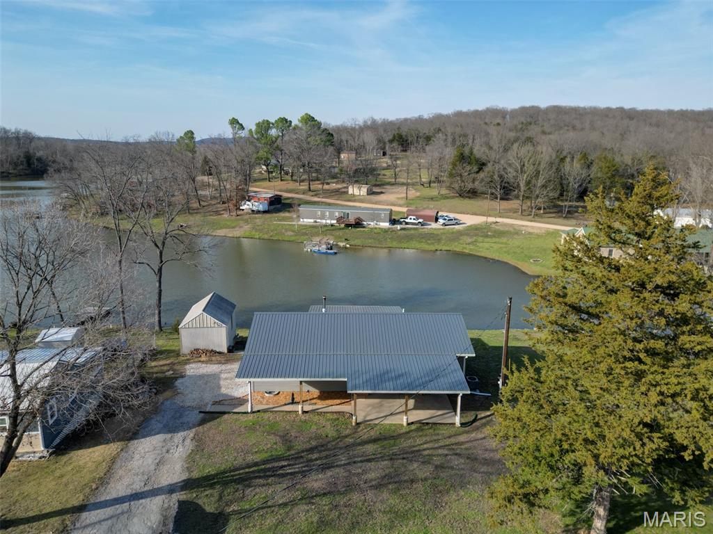Exceptional home on the water at Brown Shanty, just a short drive from Hermann, MO! Come and see your new weekend getaway or make it your permanent residence!  No Drywall anywhere!  Beautiful wood is all around!  Warm and inviting and move-in ready, this home welcomes you in and you won't want to leave! Enjoy the views of the lake from the covered deck!  Fish in the lake or get on the Gasconade River at the access just down the road! This place is perfect for anyone wanting peace and serenity on the water!  There is a little storage shed for your tools and toys, and inside you will find 3 bedrooms and 1.5 baths, a water softener, and a brand-new washer and dryer set! Stainless appliances grace the kitchen and compliment the granite countertops. A wood stove in the living area will warm the entire home on those cool Fall evenings or those cold Winter nights!  Truly a one of kind retreat! Come and see this remarkable home on the lake and start enjoying all it has to offer... fishing on the lake and floating or kayaking on the Gasconade River... this place will make memories for you and yours for years to come! NO FLOODPLAIN! Awesome!