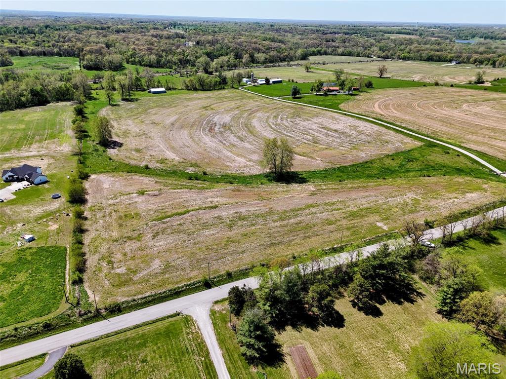 27.2 acres of prime ground just off blacktop, offering the ideal blend of convenience and opportunity. With water and electric available at the road, this property is well-positioned for your future build - whether you're planning a private residence or multiple home sites. The gently rolling terrain provides excellent building locations and scenic views, while approximately 24± acres of tillable ground add income potential or flexibility for personal use. Fully fenced and located just 2.5 miles from Hannibal Regional Hospital, this property also falls within the Hannibal School District. A rare combination of location, usability, and development potential.