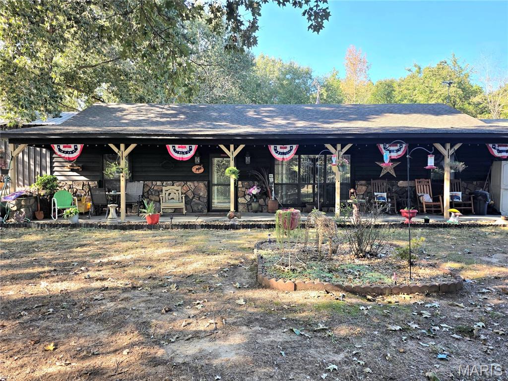 River Access, Space & Character! This well-kept 2,208 sq. ft. earth home offers 3 bedrooms and 2 bathrooms, with a spacious main bedroom, cozy fireplace, and versatile loft space ideal for a home office, hobby area, or additional living space. Enjoy relaxing or entertaining on the covered front porch that stretches the full length of the home, or take the fun outside to the large powered gazebo, which offers a great space for outdoor gatherings and can also provide additional covered parking. An attached garage adds convenience and storage, while the private river boat ramp access, puts boating, fishing, and days on the water right at your fingertips. With its unique design, generous living space, and exceptional outdoor amenities, this is a property you don't want to overlook.