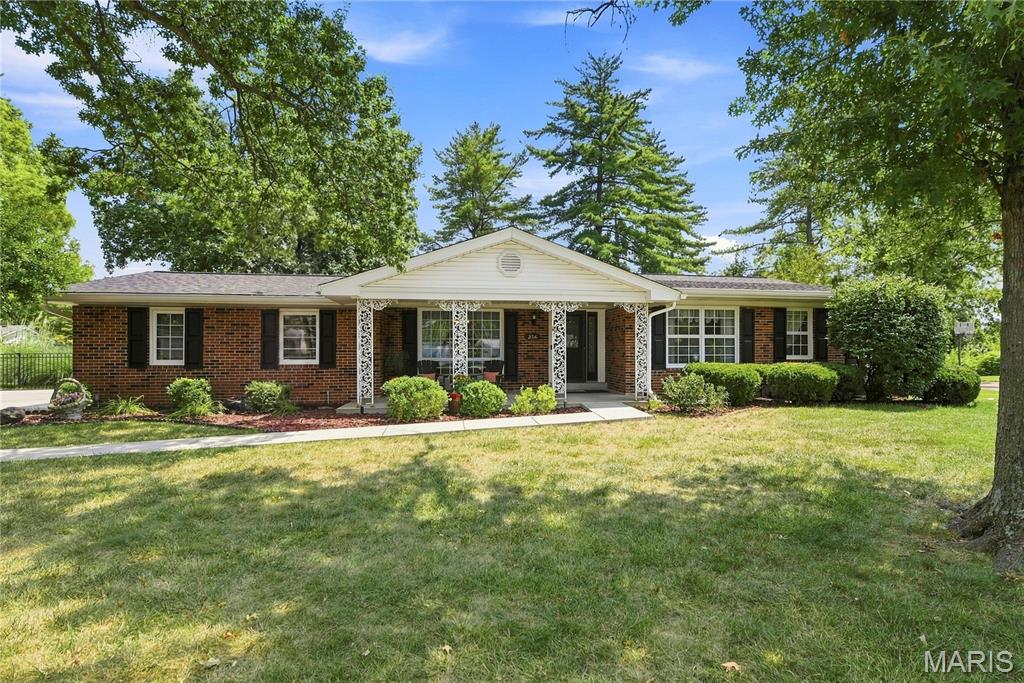 Welcome to 356 Elmcrest Drive! This charming 3-bed, 2-bath ranch sits on an oversized  lot in one of Ballwin’s most desirable locations. The home backs directly to incredible community amenities—including a playground, tennis courts, the Ballwin outdoor swimming pool, and the golf course—offering recreation and convenience right at your doorstep.
Located in the highly sought-after Parkway School District, with Claymont Elementary right in the neighborhood, this home also provides easy access to shopping, dining, and everyday essentials.
Inside, you’ll find a warm and inviting floor plan featuring a spacious Living Room and Dining Room, a comfortable Family Room with a wood-burning fireplace, and an all-season Sun Porch overlooking the large, level, fenced backyard. The interior has been freshly painted in soft neutrals, and the refinished hardwood floors are absolutely beautiful. Light-filled windows create a bright, welcoming atmosphere throughout the home.
The Kitchen/Breakfast Room features wood cabinetry and generous workspace, with clear sightlines to the dining room that make entertaining effortless. The lower level features a half bath and a great rec area for additional living space.
Major updates include: New roof, new driveway, new flooring, updated electrical panel, some newer windows, fresh interior paint, new garage door and motor, and fencing improvements.
This well-maintained home on a premium lot truly offers the best of Ballwin living. Come see you will be glad you did. It’s a great place to call home!