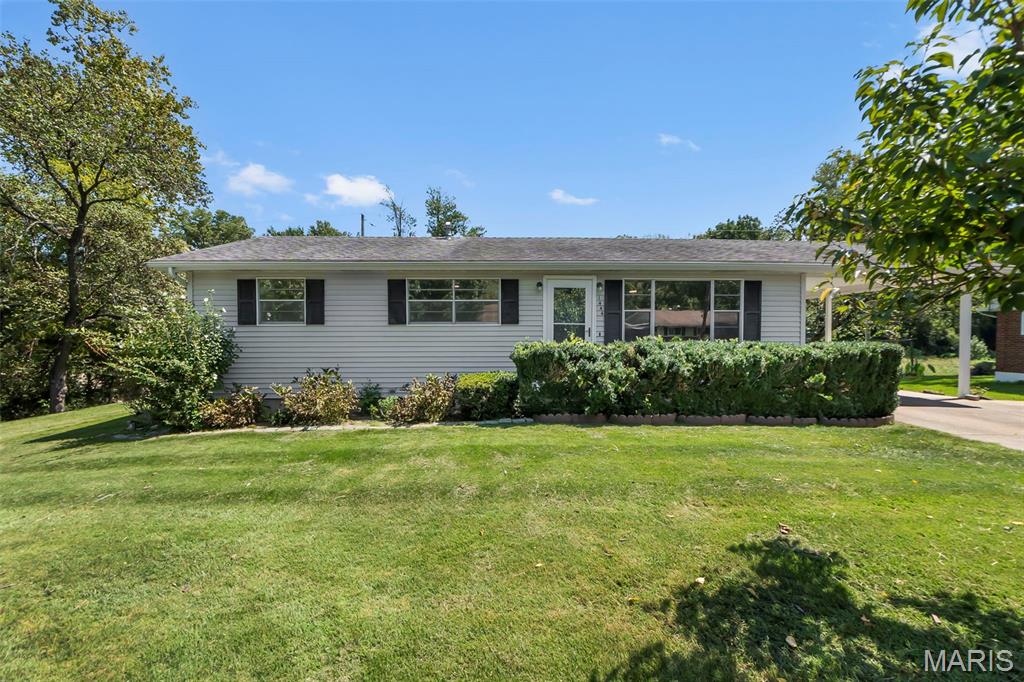 Move-in ready in the center of town - convenient to everything! Fresh paint throughout, beautiful wood floors all refinished,  new fixtures throughout, new electric panel, new hot water heater, etc. Full unfinished basement for future expansion. Fenced-in backyard, storage shed, covered parking, landscaping! Owner is a Missouri licensed Realtor. Easy to show. Come see!