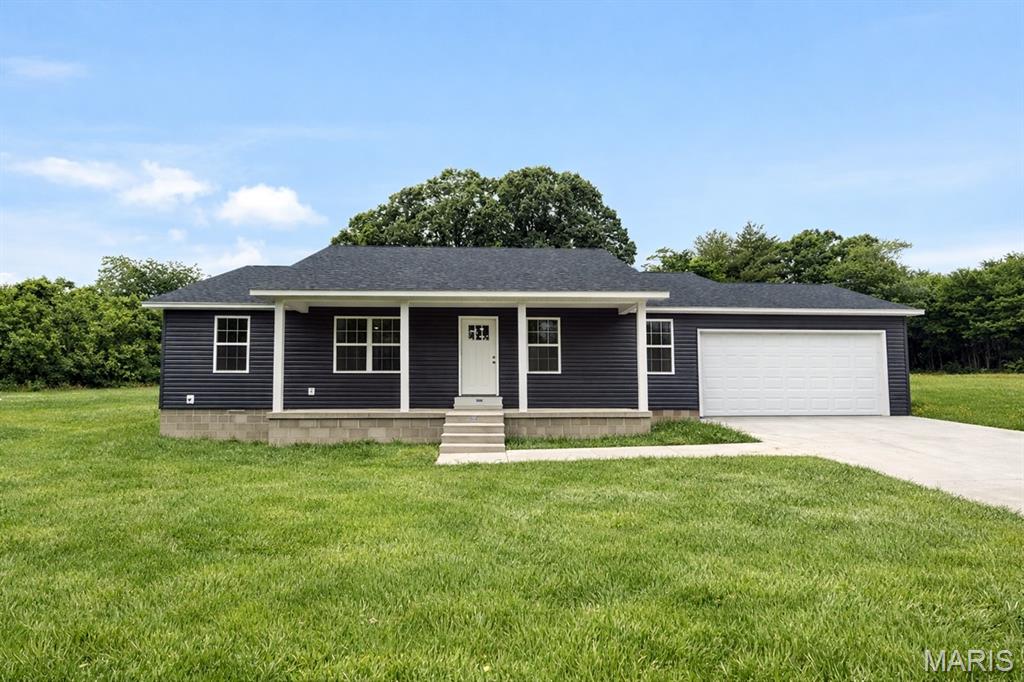 Brand new 3-bedroom, 2-bath home featuring a split floor plan just off 2 Mile Road. Built for comfort and efficiency, this all-electric home offers durable LVP flooring, double-pane tilt-in windows, soft-close custom white cabinetry, and a new HVAC system with a 10-year warranty.
The split layout provides privacy, with two bedrooms separated from the spacious primary suite featuring a walk-in closet and private bath with oversized shower. Enjoy peaceful views from the new wood deck overlooking the tree line, or relax on the covered front porch shaded by mature walnut trees.
The finished 2-car garage includes extra space for storage or a hobby shop and leads directly into the utility room with laundry hookups. Conveniently located just 1 mile from Dexter Public Schools and minutes from Hidden Trails Country Club. Additional adjoining lots available for purchase.