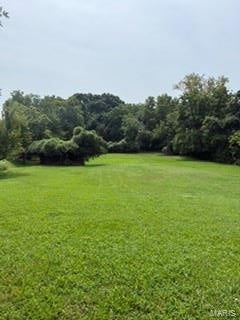 Beautiful level lot on 2.32 acres.  House on property is a tear down and unsafe.  DO NO ENTER HOUSE.  Perfect for building your dream home and having lots of room to enjoy the outdoors.  Property is near access to Hwy 270 and Hwy 55, with plenty of shopping and restaurants nearby.
