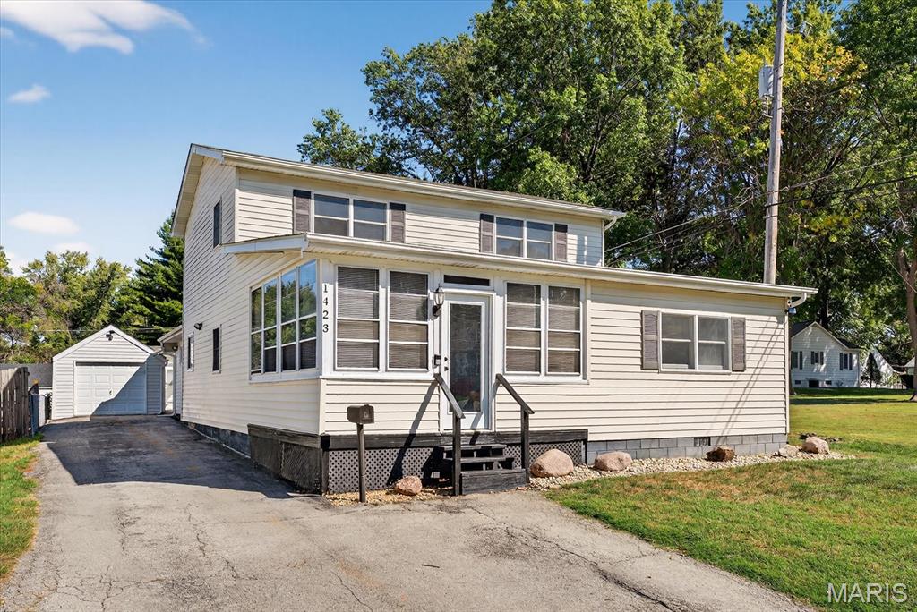 Welcome Home to 1423 Roger Avenue, a hidden gem nestled in the heart of the desirable Adair Gardens neighborhood. This isn't just a house; it’s a sprawling 2,400 approximate square foot sanctuary that offers the kind of space rarely found in mid-century builds.
Step inside to discover a versatile layout featuring 5 generous bedrooms and 3 full bathrooms, perfect for growing families, multi-generational living, or those needing dedicated home offices. The interior glows with character, featuring a mix of original hardwoods and modern tile and laminate flooring. Imagine cozy winter evenings gathered around the classic fireplace or summer afternoons in your private backyard oasis on this quiet, tree-lined street.  Schedule your showing today...this one will not last long.
