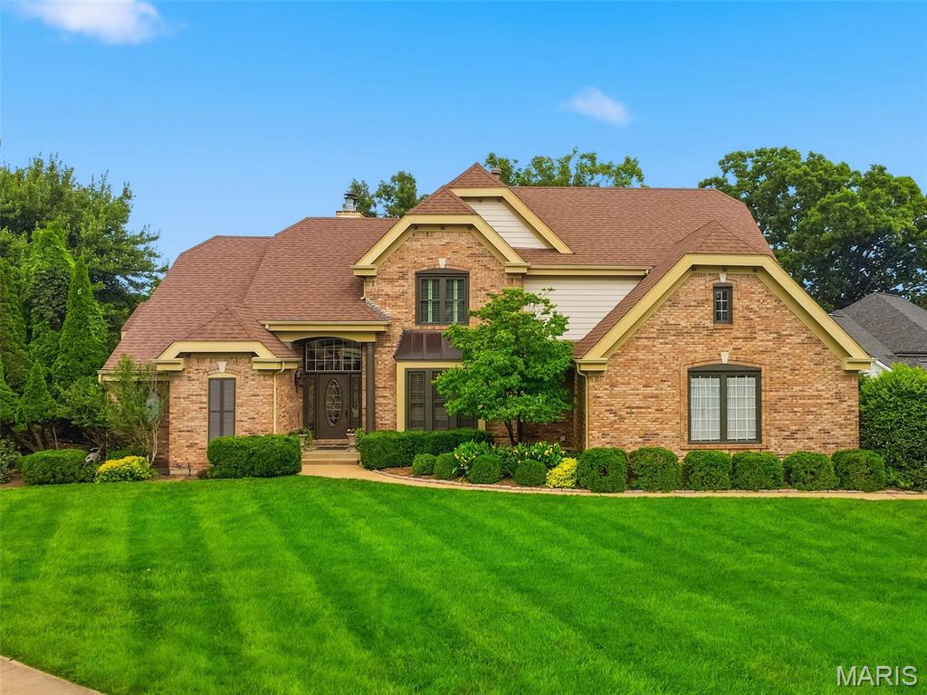 Stunning 1.5-story atrium home in the heart of Ellisville offering 5 bedrooms and 3.5 baths on the main and upper levels PLUS 2 additional bedrooms and a full bath in the walkout lower level...ideal for guests, extended family, live-in caregivers or flexible work-from-home living. The dramatic vaulted great room serves as the focal point of the home, offering soaring atrium windows, abundant natural light, a gas fireplace with brick surround & views of the gorgeous kidney-shaped saltwater pool with a sheer descent waterfall. The open floor plan flows into a center island kitchen with granite countertops, stainless steel appliances, double ovens, a brand-new smooth cooktop, a walk-in pantry & a bright breakfast room with solarium windows that bring the outdoors in. Enjoy morning coffee or evening gatherings on the screened porch, newer upper-level composite deck with aluminum railings (2025), lower deck or patio overlooking the pool and beautifully landscaped surroundings.  The main floor primary suite features a double door entry, tray ceiling, bay window, luxurious bath with separate tub and shower, dual vanities & a large walk-in closet. Upstairs are four spacious bedrooms and two Jack-and-Jill baths, both with double bowl vanities.  The finished walkout lower level is designed for entertaining and flexibility, featuring an expansive family room with a gas fireplace, wet bar & walkout access to the pool. One of the two lower-level bedrooms measures approximately 15' x 14' and includes a large walk-in closet with direct access to the full bath. A second laundry room and massive unfinished storage space complete the lower level.  Additional highlights include a main floor laundry, a 3-car side entry garage, zoned HVAC and water heater (all in 2025), a sprinkler system, 9' ceilings on the 2nd floor & lower level, numerous ceiling fans throughout, a newer pool pump & salt chlorinator & 10 new solarium window panels (2026). This home is located in a very desirable neighborhood across from Ridge Meadows Elementary and is within walking distance of Rock Hollow Trail. With its sought-after West County location, Rockwood schools, flexible floor plan, generous living space & amazing outdoor area with a pool, this home truly offers something for everyone.