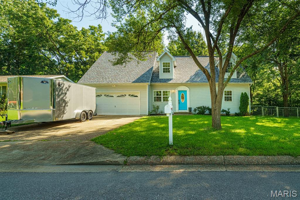 So much to offer, you gotta see to believe!  Let's start with the basics...3 bedrooms, 2.5 bathrooms, living room, kitchen, dining, utility room and a 2-car garage.  But wait!  There is another nice family room area upstairs!  There is a chain link fenced back yard and roomy side yard.  There is a cool creek behind the house that you can enjoy from the rear patio.  There are real hardwood floors in some of the home and ceramic tile in the kitchen, dining and utility rooms.  Main floor master bedroom and private bath and a big walk-in closet.  1/2 bath off of the kitchen/dining area.  This is a nice home in a nice neighborhood with great features!