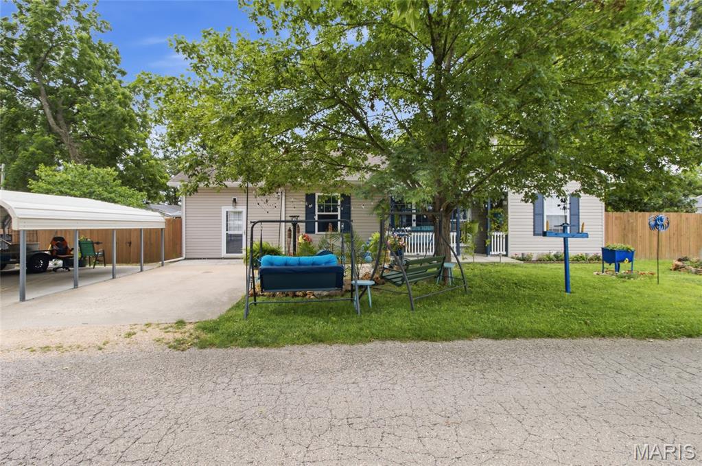 Beautifully updated and move-in ready, this charming 3-bedroom, 1.5-bath home offers the perfect balance of comfort, style, and outdoor living. From the moment you step inside, you'll appreciate the warm hardwood flooring, abundant natural light, and thoughtful updates that create an inviting place to call home. The kitchen is designed to impress with elegant quartz countertops, modern finishes, a layout that makes everyday living & entertaining effortless, and stainless steel appliances including an under-sink water purification system. Custom Levelor blinds throughout the home add both style and privacy, while the spacious family room provides the ideal gathering space for relaxing evenings or hosting friends and family. With direct access to the backyard, indoor and outdoor living blend seamlessly. Step outside to enjoy a fully fenced backyard retreat complete with a covered patio for grilling, entertaining, or simply unwinding after a long day. The detached she-shed/he-shed expands your living space with laminate flooring, a ceiling fan, and window air conditioning—perfect for a home office, hobby room, workout space, or private getaway. A welcoming covered front porch offers another peaceful spot to enjoy your morning coffee. Adding even more value, the brand-new Whirlpool washer and dryer stay with the home, making your move even easier. Located near several state parks, the Mark Twain National Forest, the Meramec River, and the Ozark National Scenic Riverways, outdoor enthusiasts will love the easy access to camping, kayaking, hiking, fishing, and year-round adventure. Don't miss your opportunity to own this beautifully maintained home and enjoy the best of small-town living with endless outdoor recreation nearby. Schedule your private showing today!