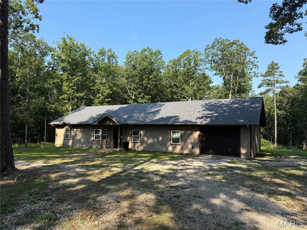 Escape to the peace and privacy of country living on 3.49 +/- acres surrounded by woods and abundant wildlife. This custom built home is only three years old and offers 3 bedrooms, 2 baths, and quality finishes throughout, including 9-foot ceilings and durable vinyl plank flooring.
The living room features a vaulted wood ceiling, great natural light, and an open flow into the dining area and kitchen. You’ll love the cabinet space, glass front accents, soft close drawers, and full appliance package with range, refrigerator, dishwasher, microhood, and air fryer oven.
The primary suite is designed for comfort with a walk in closet, double vanity, custom tile shower, and a beautiful soaking tub perfect for unwinding at the end of the day. Additional perks include a spacious laundry room with countertop workspace and a 14x28 heated and cooled garage with pull-down attic storage.
Room to roam, modern construction, and the setting buyers dream about, this one is ready to call home.