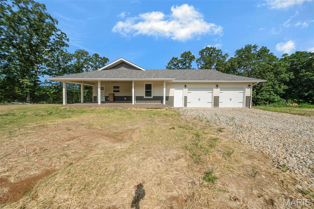 Welcome to Whispering Oaks, one of the area's newest subdivisions, conveniently located just minutes from Rolla! This newly constructed 3-bedroom, 2-bathroom home offers approximately 1,542 square feet of thoughtfully designed living space on 5 private acres m/l. The open-concept layout seamlessly connects the kitchen, dining, and living areas, creating the perfect setting for everyday living and entertaining. The kitchen is sure to impress with a large center island featuring seating, custom cabinetry, stainless steel appliances, and a spacious pantry. The private primary suite offers a large closet and a spa-like ensuite bathroom with a double vanity. Enjoy the peaceful country setting where abundant wildlife and beautiful surroundings provide the perfect place to relax while remaining just minutes from town. Don't miss your opportunity to make this stunning new home yours—schedule your private showing today!