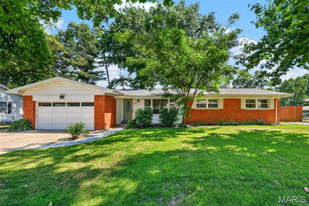 Step inside this beautifully refreshed 3-bedroom, 2-bath ranch offering a bright, open layout and plenty of room to enjoy! The spacious living room flows into the updated kitchen and family room, complete with a cozy fireplace and luxury vinyl plank flooring. The kitchen features white cabinetry, granite countertops, newer stainless steel appliances, and pantry.
The gorgeous dining room makes a statement with elegant wainscoting and beautiful hardwood floor. Down the hall you’ll find three nice sized bedrooms featuring fresh trim, updated window casings, and closet organizers. The primary suite includes a private bath with ceramic tile flooring and a spacious walk-in shower with a rainfall showerhead. A second full bath offers another walk-in shower and ceramic tile flooring. Main-floor laundry adds everyday convenience.  Additional features include beautiful hardwood flooring throughout much of the home, including the bedrooms; a two-car attached garage; extra parking and a sidewalk providing easy access to the backyard. The HVAC system, heat pump, and water heater were replaced in 2023. Relax on the patio overlooking the large, level, fenced backyard—an ideal setting for entertaining.
