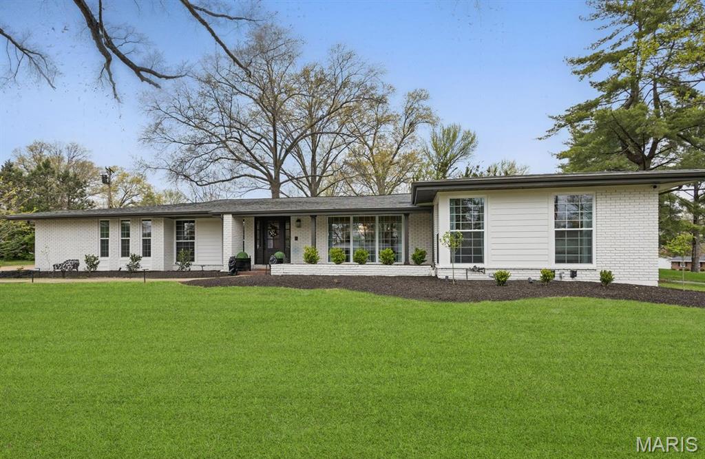Welcome to this impeccably renovated home, thoughtfully designed for all stages of life. With chic custom finishes & attention to detail, this property is a true showstopper. The main floor features 3 bedrooms, 2.5 bathrooms, & seamless transitions between the dining room, family room, kitchen, & outdoor living space. Natural light streams through floor-to-ceiling windows, while the finished 1,515 sq ft basement offers a guest sleeping area along with a full bathroom, space for play or a gym, & abundant storage. Ideal for entertaining, the outdoor area boasts a gas fireplace, TV & grill hookups, & ample room for dining & lounging, surrounded by new landscaping & a spacious side yard. Located on a cul-de-sac in the Kirkwood school district, the home showcases marble flooring in the bathrooms, custom cabinetry, sophisticated trim, & modern updates like new HVAC systems, water heaters, windows, lighting, & Hardie board siding. Stylish & functional, this dream home awaits! The neighborhood features 3 neighborhood parks, tennis/pickleball and basketball courts, and a swimming pool and swim club that you can join and get to know the neighbors! Close to many great restaurants, grocery stores, pet stores and more!!