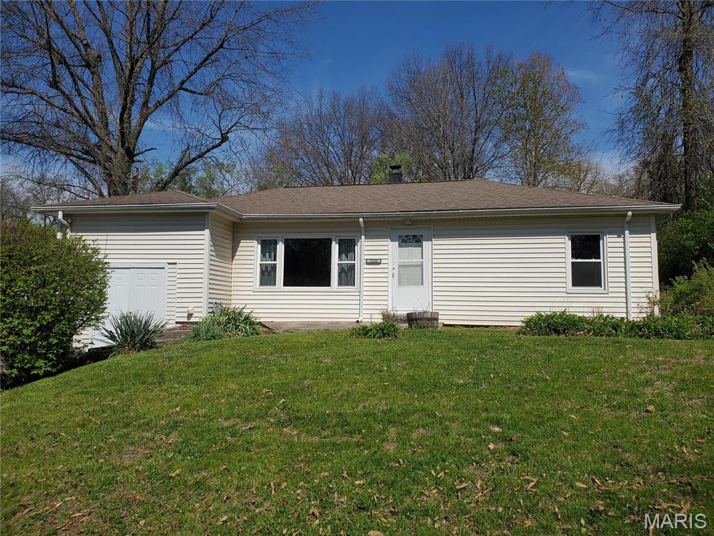Move in ready home with large front yard. Updated bathroom with modern fixtures. Original hardwood floors in Living Room and both Bedrooms. Luxury Vinyl Plank flooring in Kitchen and Dining Room. Storage area with interior and exterior access. All appliances stay, Stainless Steel gas stove, microwave, refrigerator with new compressor and brand new dishwasher. Convenient laundry room with washer and dryer included. A/C and Furnace serviced 2025. Shady backyard with many perennial plants and storage shed. Clean and well maintained home. Agent related to seller.