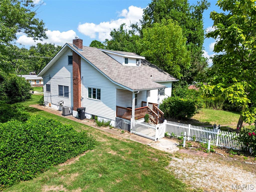 1930's farmhouse on a fantastic very large lot. Renovate, add on to the existing home, build new, or sub-divide the lot. With almost .70 acres, there are so many great options! This bungalow has a large eat in kitchen, a formal dining room, large living room, large entry foyer, a generous main level bedroom, and the full bathroom for the home. The second level has two large bedrooms, adding a bathroom upstairs is a definite possibility.  The lot is very private and the house is set back from the street. Access to the detached oversized two car garage and off street parking comes off the driveway leading from Sappington Barracks.  Property to be sold As-Is. Seller will make no warranties,  provide inspections or occupancy. Make your appointment today!