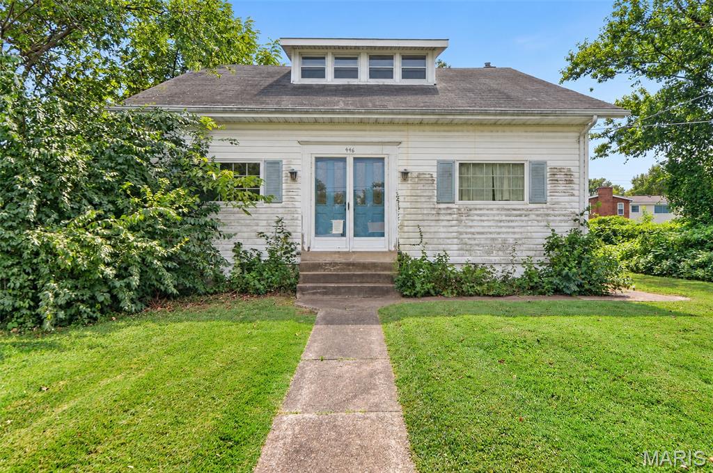 1930's farmhouse on a fantastic very large lot. Renovate, add on to the existing home, build new, or sub-divide the lot. So many good options! This bungalow has a large eat in kitchen, a formal dining room, large living room, large entry foyer, a generous main level bedroom, and the full bathroom for the home. The second level has two large bedrooms, adding a bathroom upstairs is a definite possibility.  The lot is very private and set back from the street. Access to the detached oversized two car garage and off street parking comes off the driveway leading from Sappington Barracks.  Property to be sold As-Is. Seller will make no warranties,  provide inspections or occupancy. Make your appointment today!