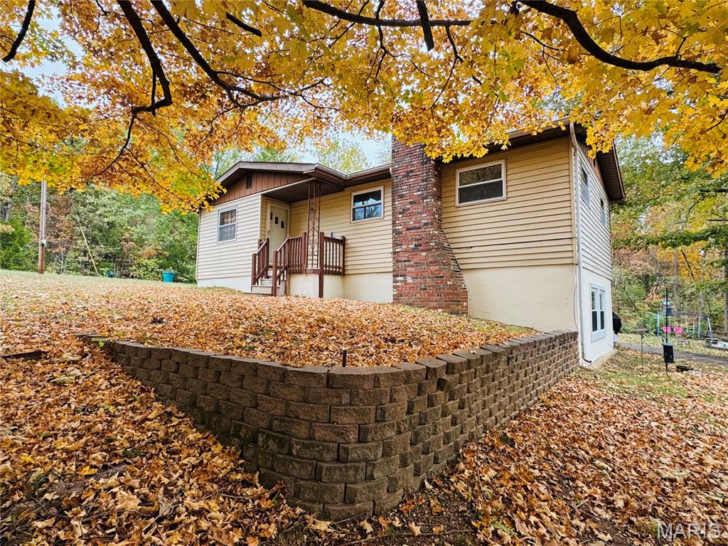 Welcome to your lakeside paradise!  This charming 3-bedroom, 2-bath home is nestled within a secure, gated private lake community and sits on a spacious corner lot perfect for enjoying the outdoors.  Relax or entertain on the expansive deck, take advantage of easy lake access for boating and water activities, and cozy up by the wood-burning fireplace on cool evenings.  The basement family room adds extra living space for relaxation or recreation.  Combining comfort, natural beauty, and endless potential, this home offers the ultimate lakeside lifestyle.  Don't miss this extraordinary opportunity - schedule your private showing today!