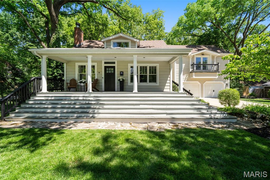 Est. 1922. Nestled in the heart of highly desirable Webster Groves, this beautifully renovated home perfectly blends timeless architectural charm with the modern updates today’s buyers are searching for. Situated in a picturesque tree-lined neighborhood just moments from the shops, restaurants, coffee houses, and community favorites that make Webster Groves so special, this exceptional 4 bedroom, 3.5 bath home offers character, warmth, and functionality throughout. A large, stately covered front porch creates an unforgettable first impression and welcomes you into a home filled with rich hardwood floors, natural light, and thoughtfully designed living spaces. One of the home’s most significant renovations was the complete transformation of the former family room above the garage into a stunning private primary suite featuring a spacious bedroom, luxurious en suite bath, walk-in closet, and convenient second floor laundry. The kitchen was completely redesigned with both style and functionality in mind, and a wall was opened between the kitchen and dining room to create an inviting, connected layout ideal for everyday living and entertaining. The rear wall of windows fills the home with natural light while offering peaceful views of the private backyard retreat featuring a large deck and privacy fencing. The flexible floor plan includes a main floor bedroom with en suite full bath, offering excellent options for guests, office space, or additional living flexibility, along with a convenient main floor powder room. Upstairs features two additional bedrooms, a full hall bath, and the spacious primary suite retreat. Additional highlights include an attached 2 car garage, beautiful hardwood flooring throughout much of the home, and the perfect balance of historic character and modern convenience. Rarely does a renovated Webster Groves home combine this level of charm, walkability, and thoughtful updating in such a sought-after location. Don't miss this one!