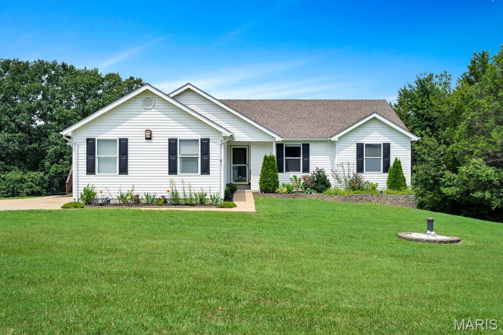 Amazing well-kept walkout ranch on nearly 3 acres! Whether it's privacy, entertaining or family life, this home does it all! With an open floor plan and over 2,500 total sq feet, ranches with this combo are tough to find! We've got plenty of driveway space and a HUGE front yard. Side entry garage with plenty of storage hardware! Inside is an appealing entry foyer, main level laundry, eat-in kitchen with granite, black stainless and breakfast room overlooking the beautiful deck and private back yard! The vaulted living room is complete with a wood burning fireplace and office nook/cabinetry! 3 bedrooms with tastefully updated bathrooms complete the main level. The lower level is partially finished with a walkout to an oversized patio and includes a roughed in bath, water softener, sleeping area and plenty of storage space! Home also features a whole-house vacuum, awesome shed/workshop area to the rear and the pergola on the deck stays with the home!